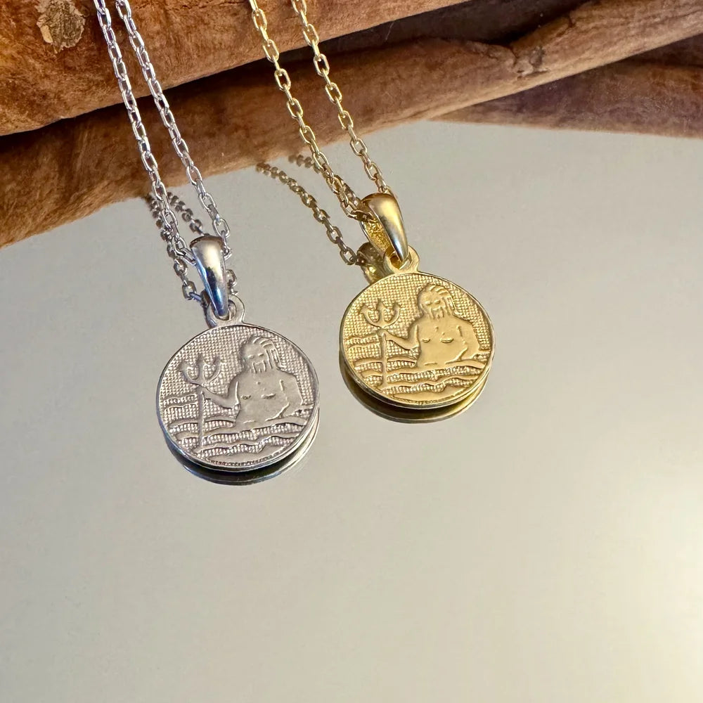Silver and gold pendant necklaces featuring ocean-themed designs, perfect for women who love vintage jewelry.