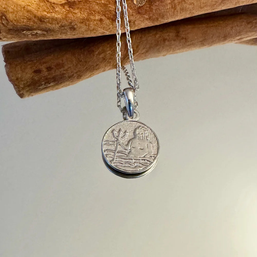 Sterling silver pendant necklace with an engraved ocean design, perfect for women who appreciate minimalist jewelry.