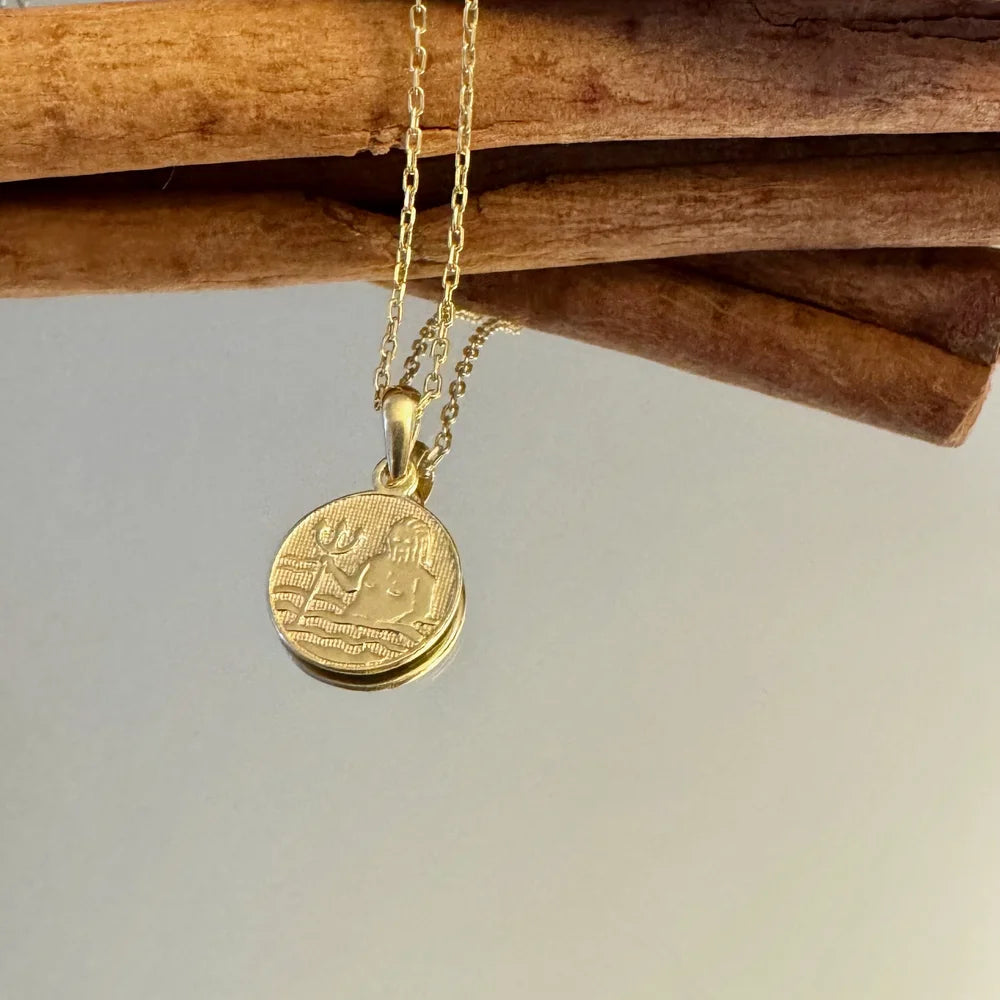 Gold pendant necklace with a detailed coin design, perfect for women seeking vintage-style jewelry for special occasions.