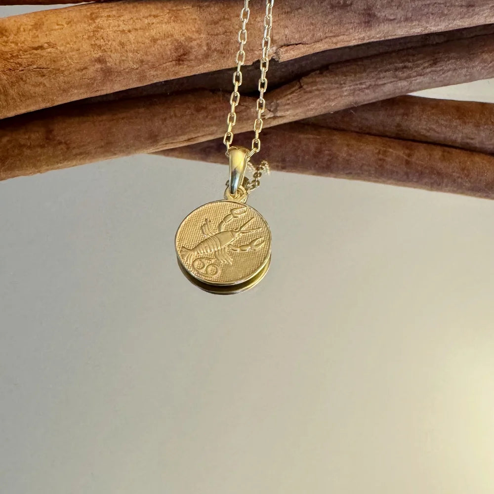 Gold lobster pendant necklace, perfect for women seeking a chic, unique accessory for casual or special occasions.