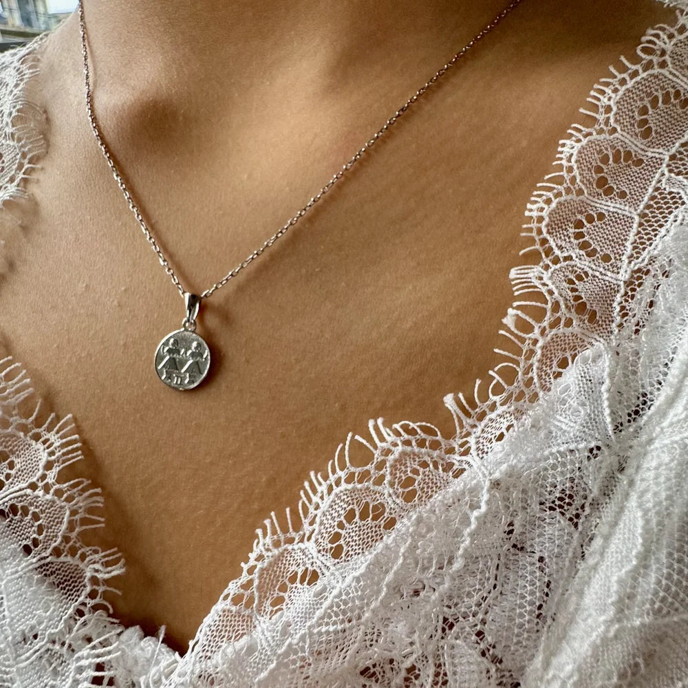 Sterling silver pendant necklace featuring a vintage coin design, perfect for women seeking a classic, timeless accessory.