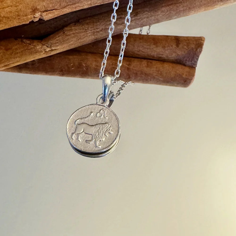 Silver charm necklace featuring a lion design, perfect for women seeking a unique, minimalist accessory.