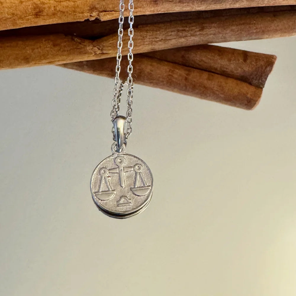 Silver zodiac scales pendant necklace, perfect for women. Ideal for everyday wear or special occasions.