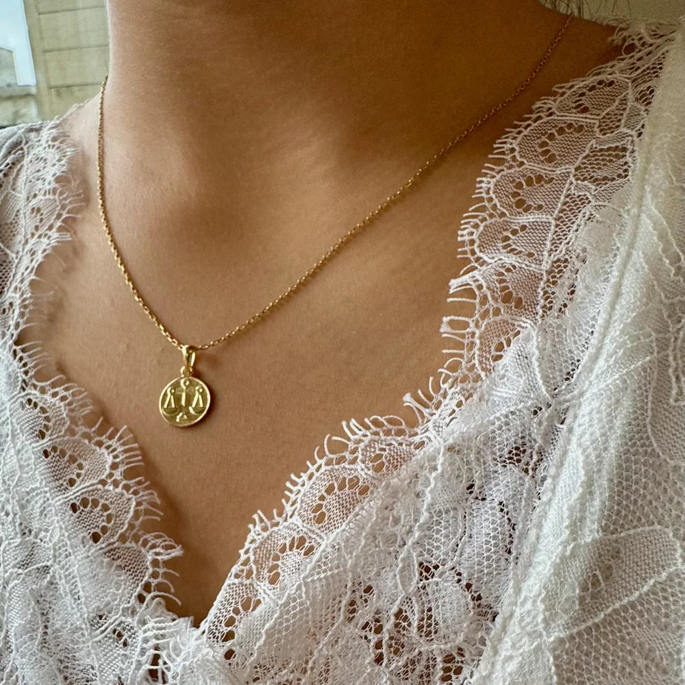 Elegant gold zodiac pendant necklace for women, perfect for casual or special occasions, featuring a stylish minimalist design.