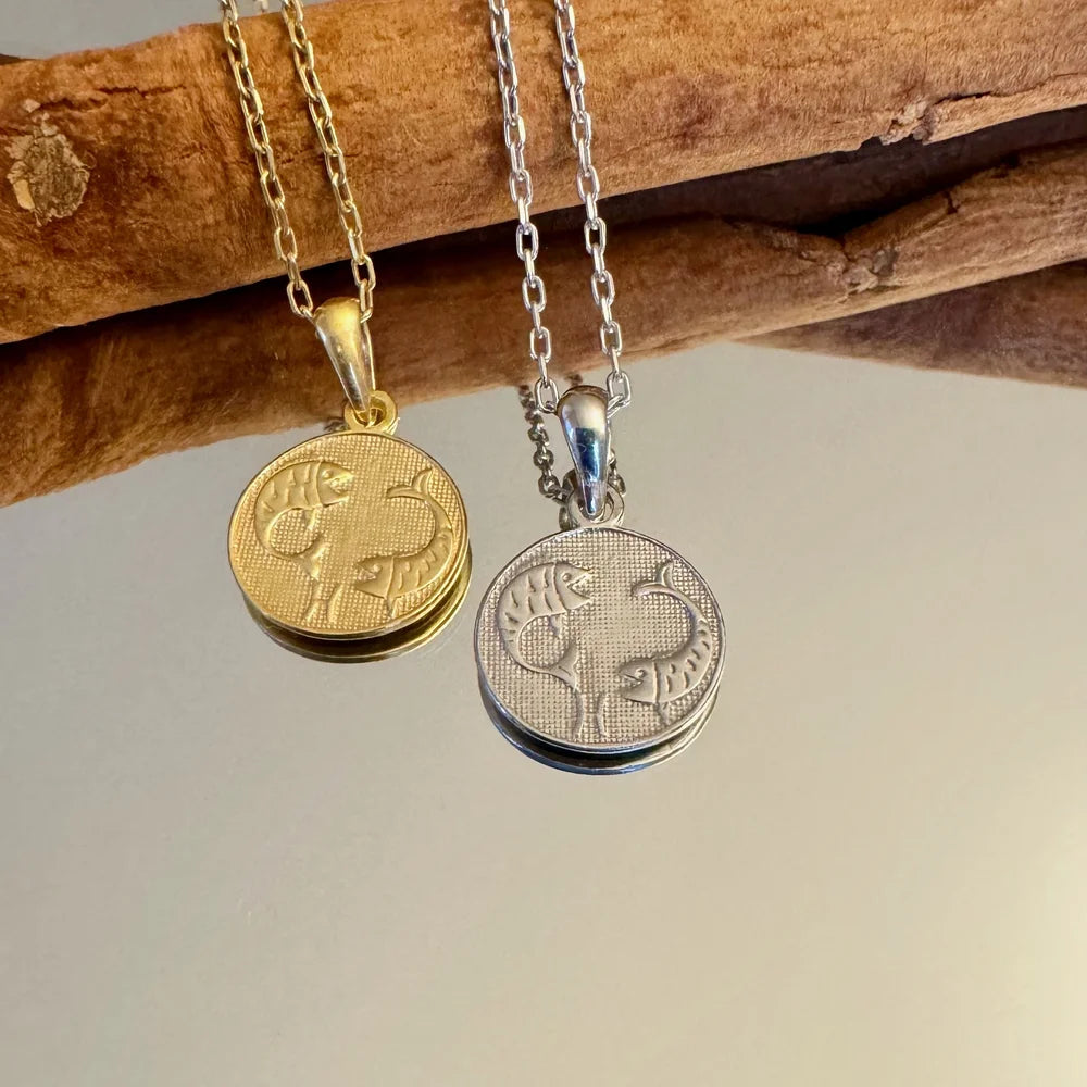 Gold and silver Pisces zodiac pendant necklaces, perfect for women who love unique, minimalist jewelry.