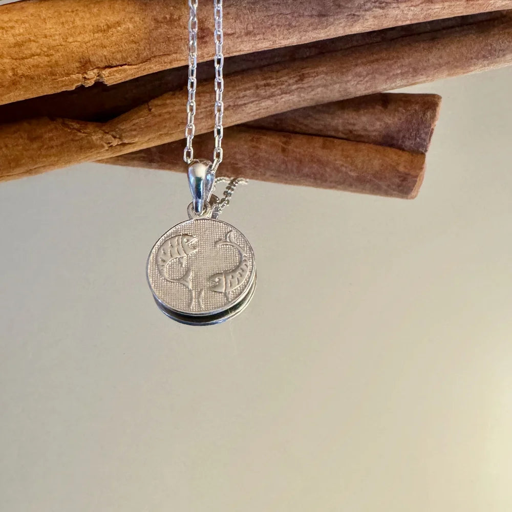 Sterling silver zodiac necklace with intricate fish design, perfect for women who love minimalist astrology jewelry.