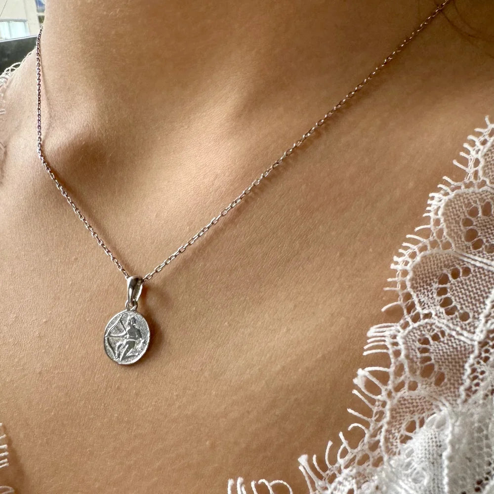 Silver pendant necklace featuring an elegant design, perfect for women seeking a classic, minimalist style.