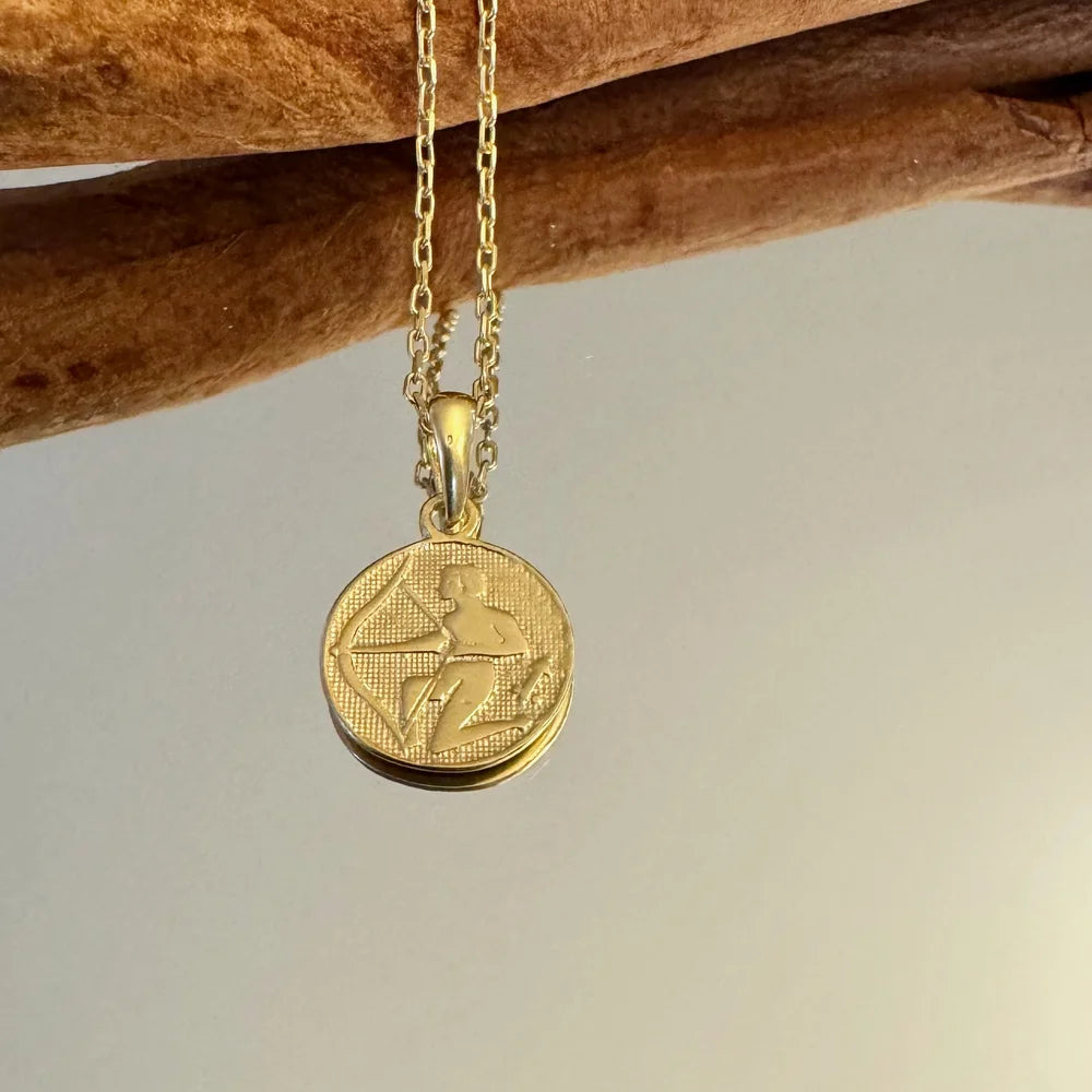 Gold pendant necklace featuring a unique archer design, perfect for women who love classic minimalist jewelry.