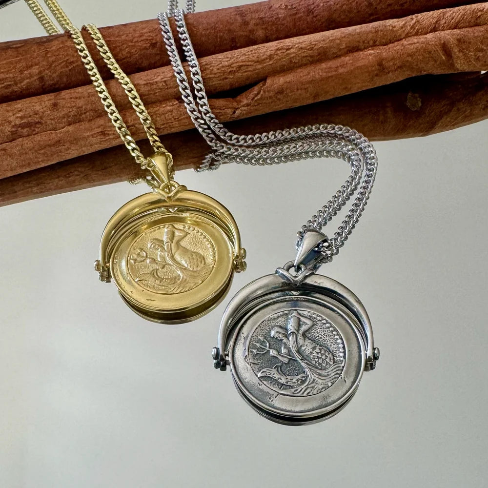 Gold and silver vintage mermaid lockets on chains, perfect for women seeking unique, whimsical jewelry for any occasion.
