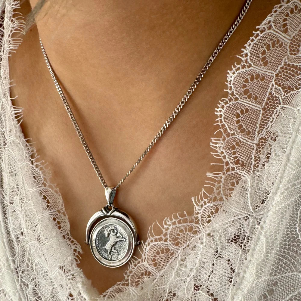 Sterling silver pendant necklace with intricate design, perfect for women’s vintage style on special occasions.