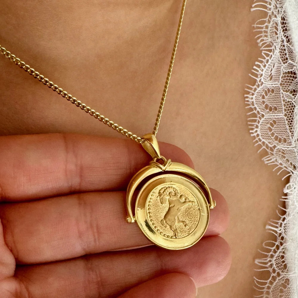 Gold coin pendant necklace featuring intricate engraving, perfect for women seeking a vintage, timeless accessory.