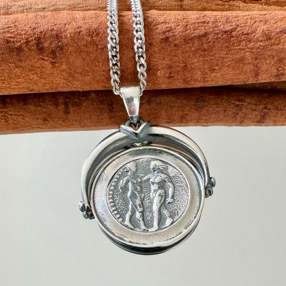 Sterling silver pendant necklace with vintage design, showcasing classic art, perfect for unisex wear on special occasions.