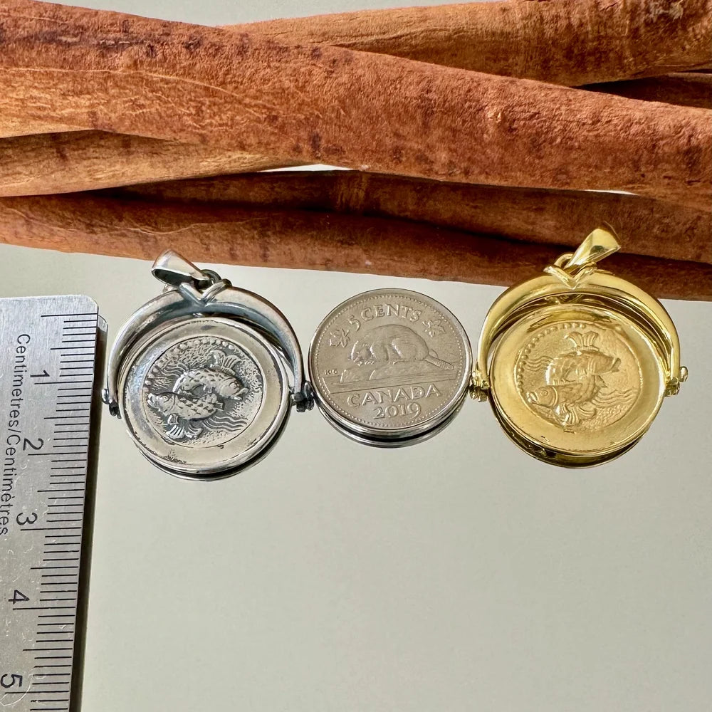 Vintage-style coin pendants in silver and gold, perfect for unisex wear, adding a unique touch to any outfit.