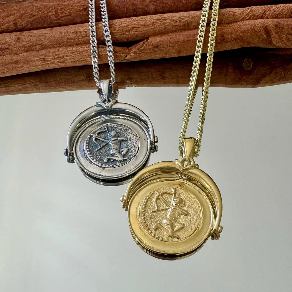 Silver and gold vintage lockets featuring intricate archer designs, perfect for unisex, special occasions.