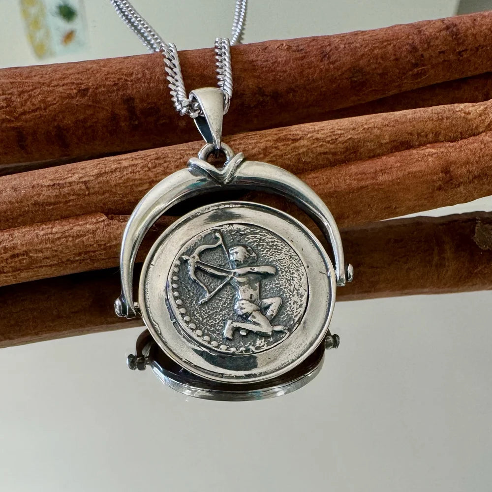 Sterling silver zodiac pendant necklace featuring a Sagittarius design, perfect for women who love unique, astrological jewelry.