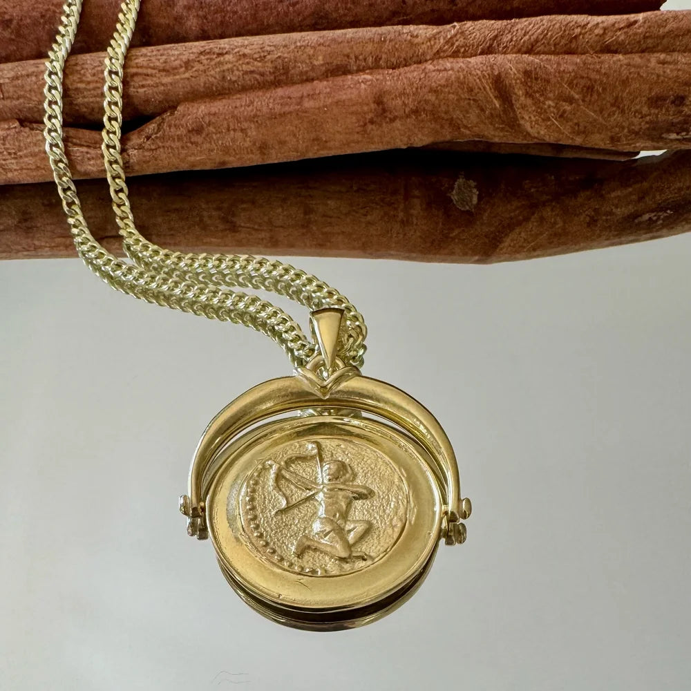 Gold vintage locket necklace with intricate design, perfect for women seeking unique, classic jewelry for any occasion.