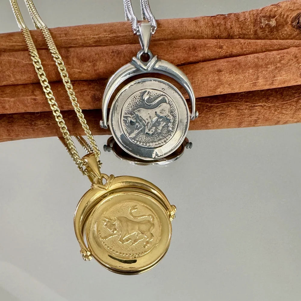 Gold and silver zodiac pendants for men and women, featuring intricate animal designs, perfect for astrology enthusiasts.