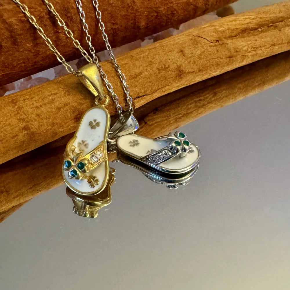 Gold and silver flip-flop pendants adorned with green gemstones, perfect for women who love whimsical beach-inspired jewelry.