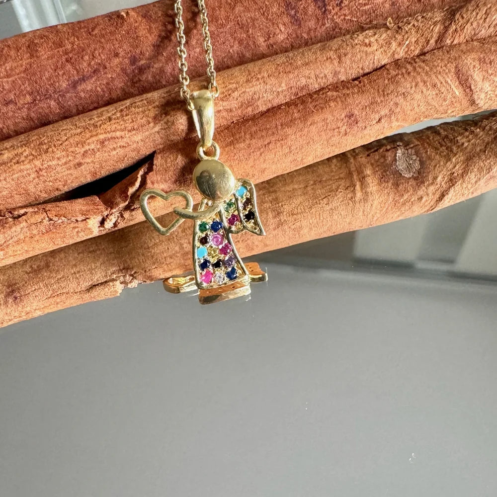 Gold angel pendant necklace adorned with multicolored gemstones, perfect for women seeking a whimsical, heartfelt accessory.