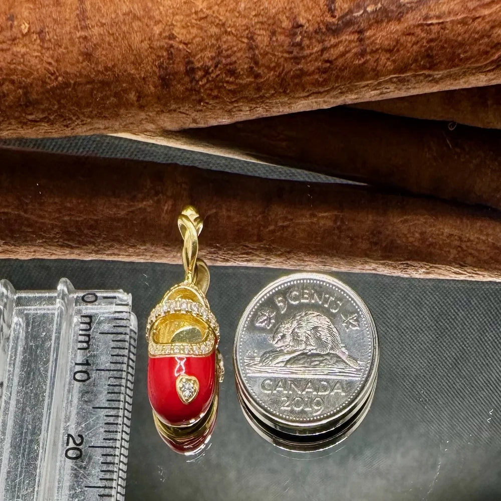 Golden red enamel charm pendant, adorned with sparkling accents, perfect for women seeking vintage-style jewelry.