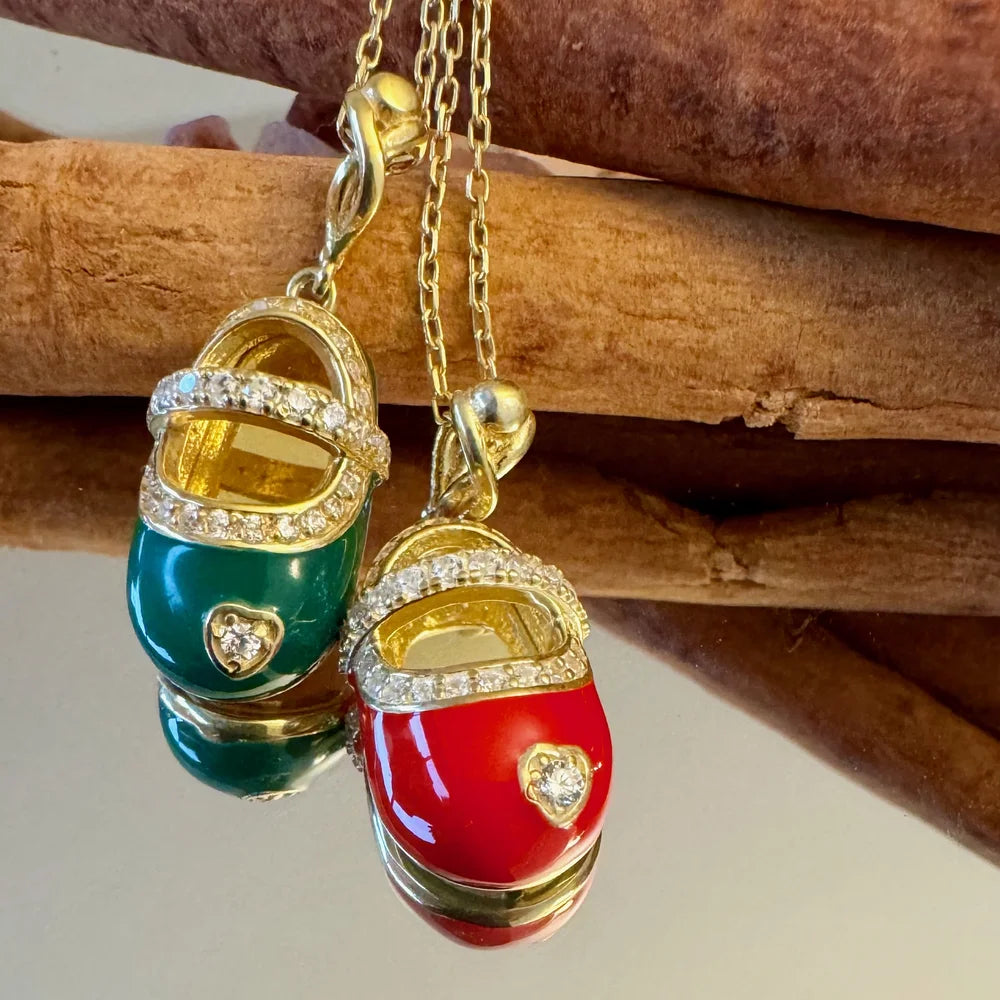 Gold charm necklace featuring colorful red and green baby shoes, adorned with sparkling crystals, perfect for women who love playful vintage styles.