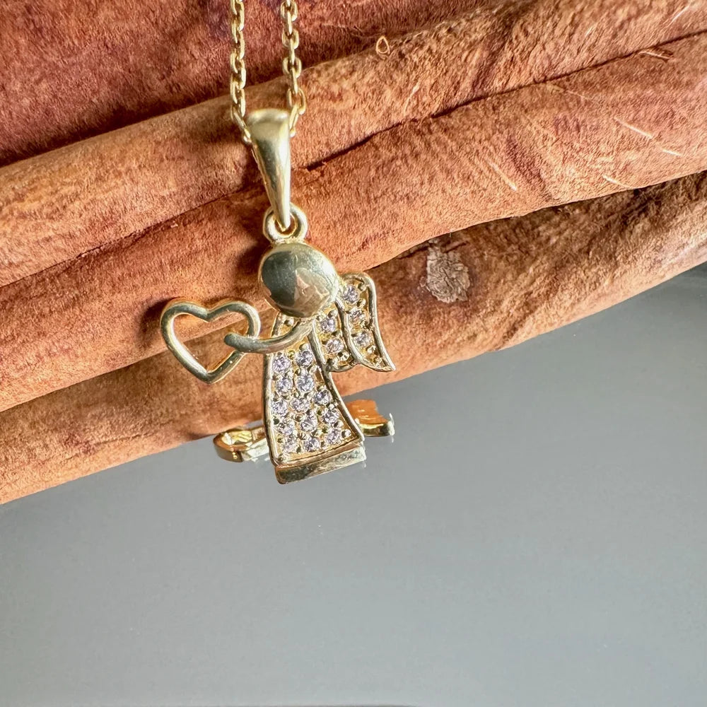 Gold angel pendant necklace with sparkling rhinestones, perfect for women seeking a classic, heartfelt accessory.