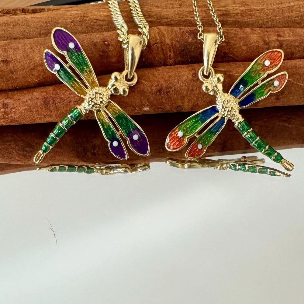 Colorful dragonfly pendant necklaces in gold, featuring vibrant enamel details, perfect for women or unisex casual styles.