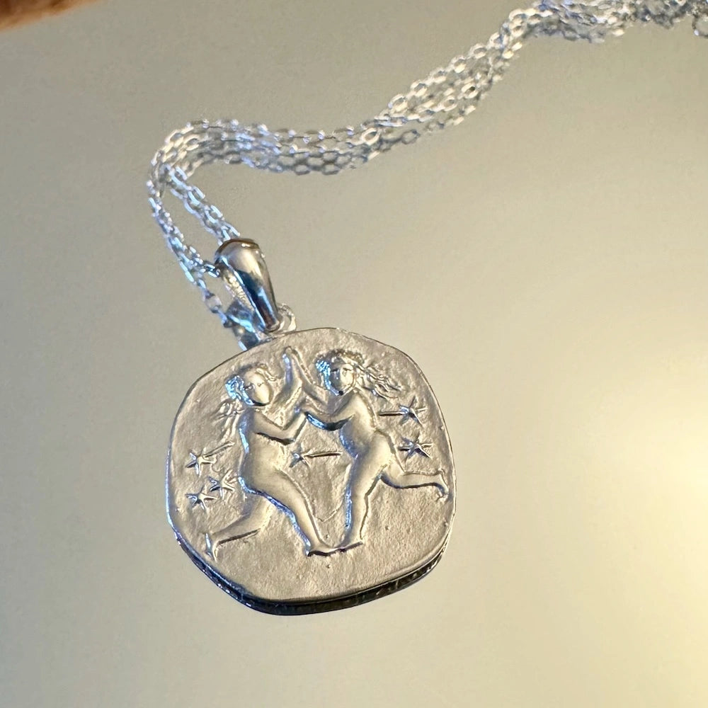 Sterling silver Gemini pendant necklace, perfect for women who appreciate celestial and zodiac-inspired jewelry.