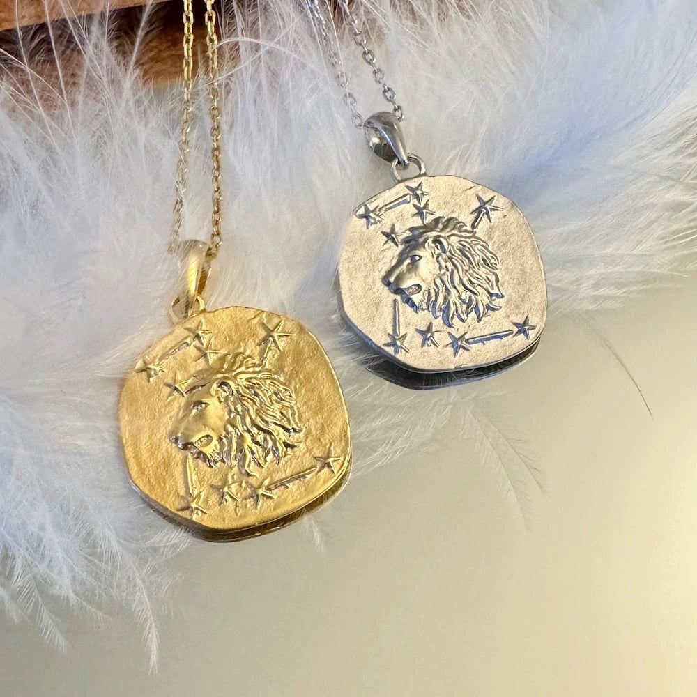 Gold and silver lion pendant necklaces, perfect for women seeking a classic zodiac-inspired accessory.