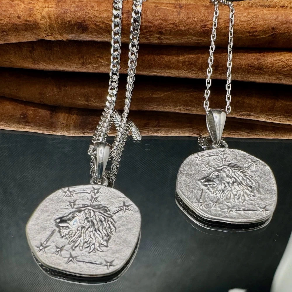 Silver lion pendant necklaces with intricate designs, perfect for men and women seeking a bold, unisex style.