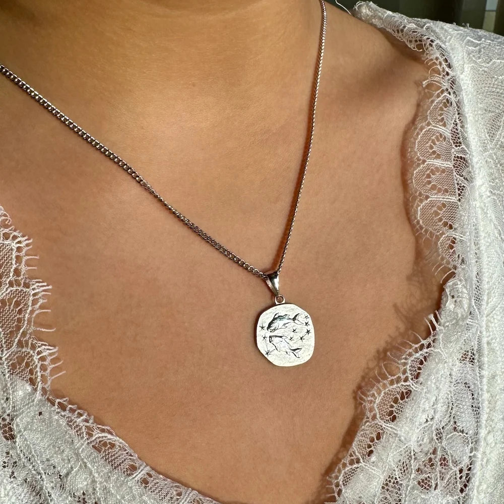 Sterling silver pendant necklace featuring a delicate dolphin design, perfect for women seeking a minimalist boho style.