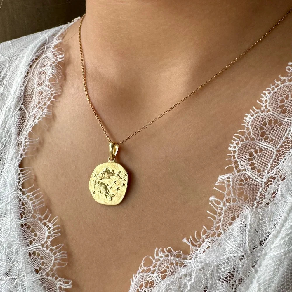 Delicate gold pendant necklace with floral design, perfect for women seeking minimalist elegance for casual or special occasions.