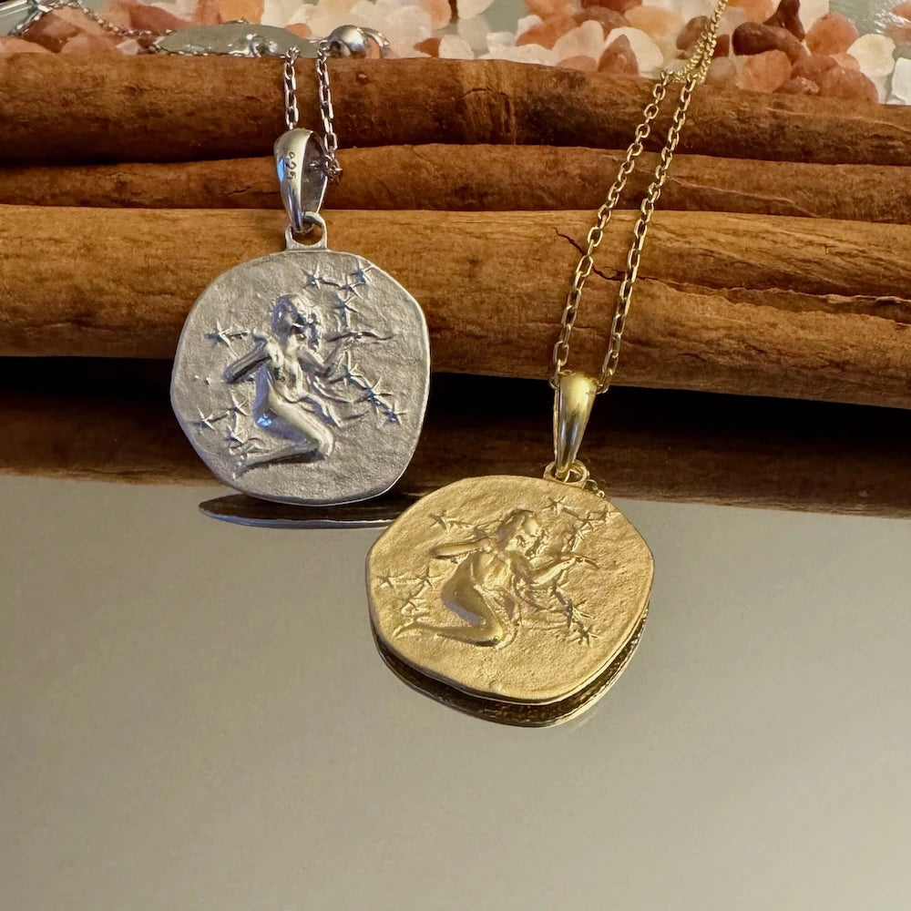 Silver and gold fairy pendants on chains, perfect for women seeking whimsical, bohemian jewelry styles.