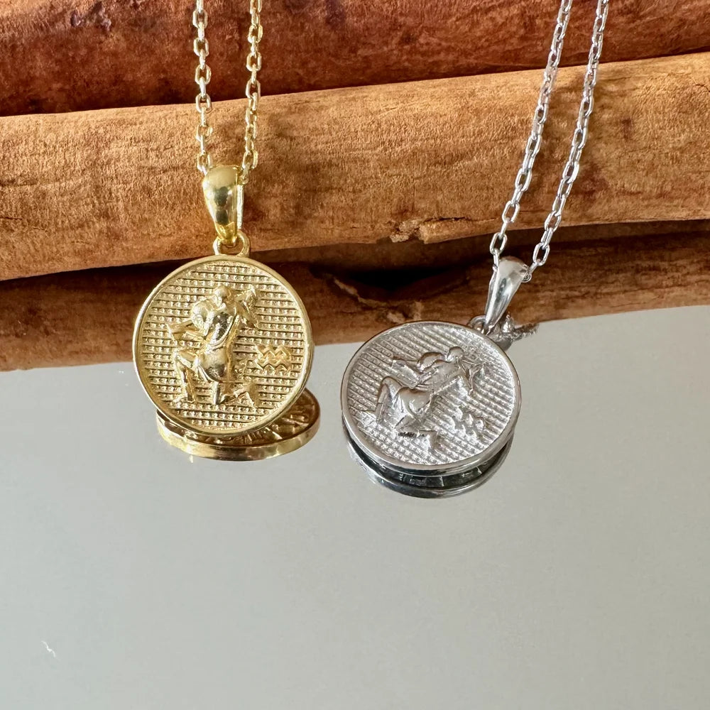 Gold and silver pendant necklaces featuring intricate designs, perfect for women's vintage jewelry collections.
