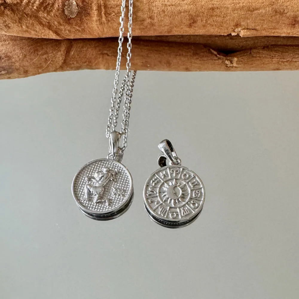 Silver zodiac pendant necklace for women, featuring intricate zodiac symbols and a unique vintage design, perfect for any occasion.
