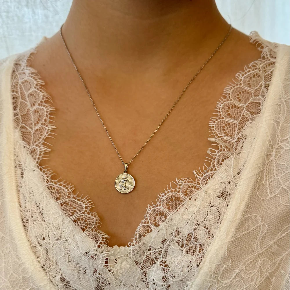 Delicate silver pendant necklace featuring a vintage design, perfect for women seeking a chic, classic accessory.