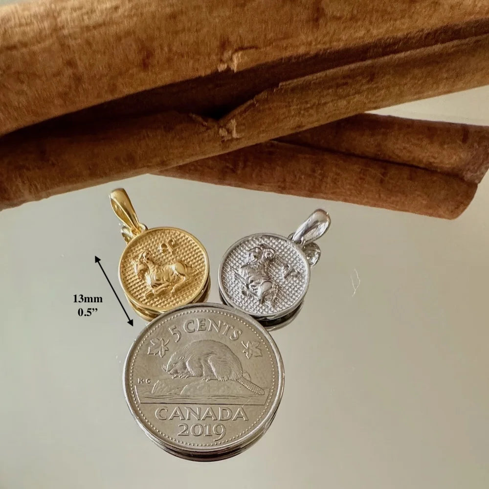 Gold and silver collectible animal pendants, perfect for unisex vintage styles or charm bracelets. Ideal for special occasions.