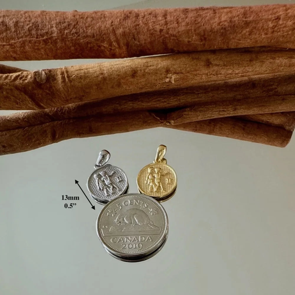 Vintage gemstone-adorned pendants in silver and gold, perfect for women seeking unique, minimalist jewelry styles.