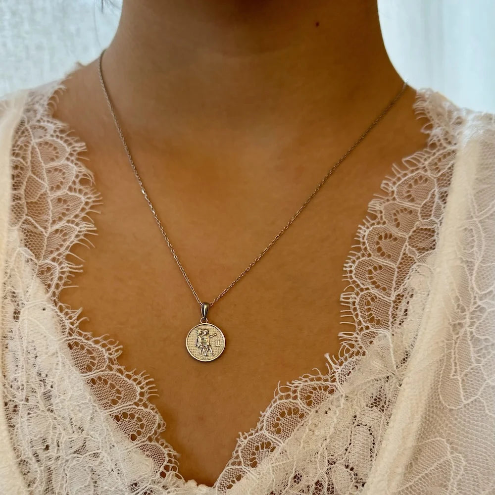 Sterling silver minimalist pendant necklace, featuring a unique engraved design, perfect for women's casual or formal occasions.