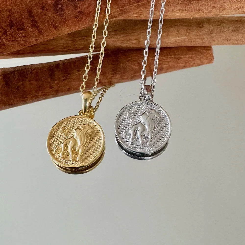 Gold and silver lion pendant necklaces for men and women, perfect for adding a vintage touch to any outfit.