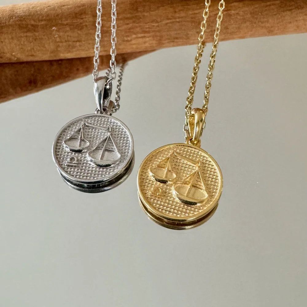 Sleek silver and gold sailboat pendants on delicate chains, perfect for nautical-themed jewelry lovers. Ideal for women.