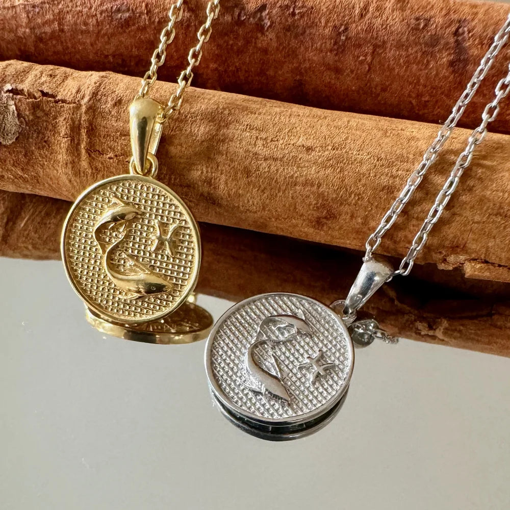 Gold and silver moon and star pendants on chain, perfect for women seeking minimalist celestial jewelry.