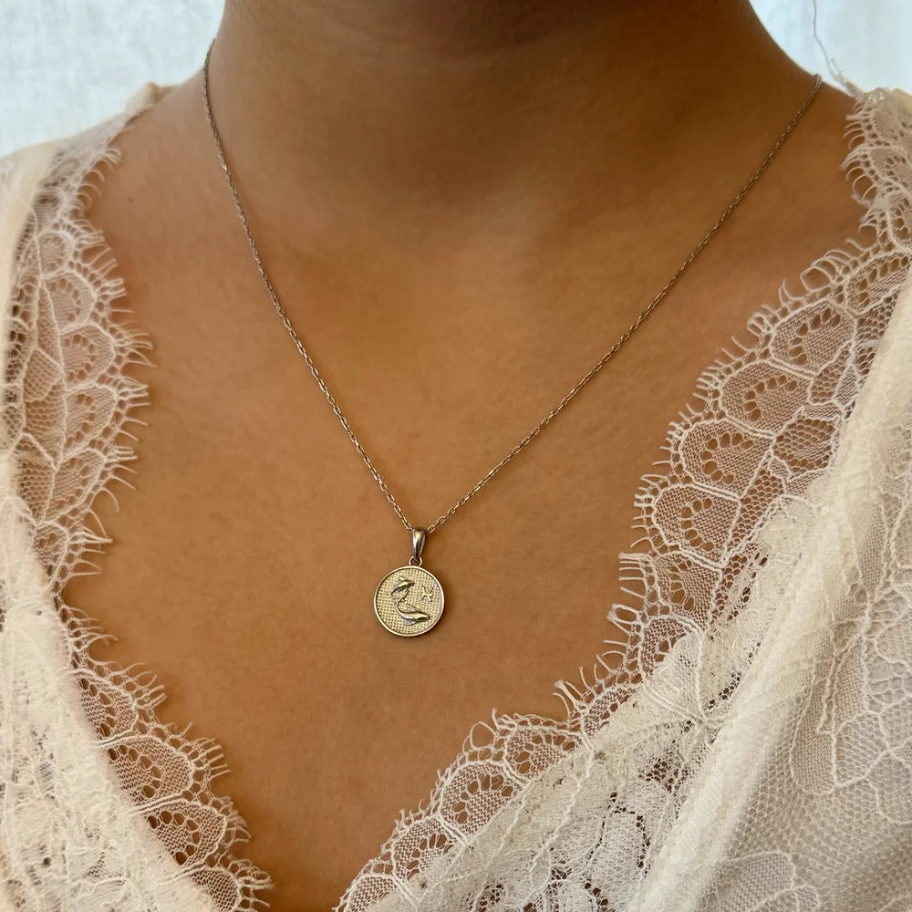 Sterling silver pendant necklace with a unique design, perfect for women seeking minimalist elegance for any occasion.