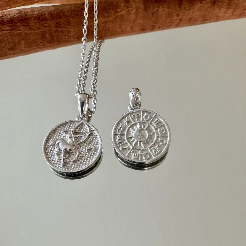 Sterling silver zodiac pendant necklace, featuring astrological signs, perfect for women who love celestial-inspired jewelry.
