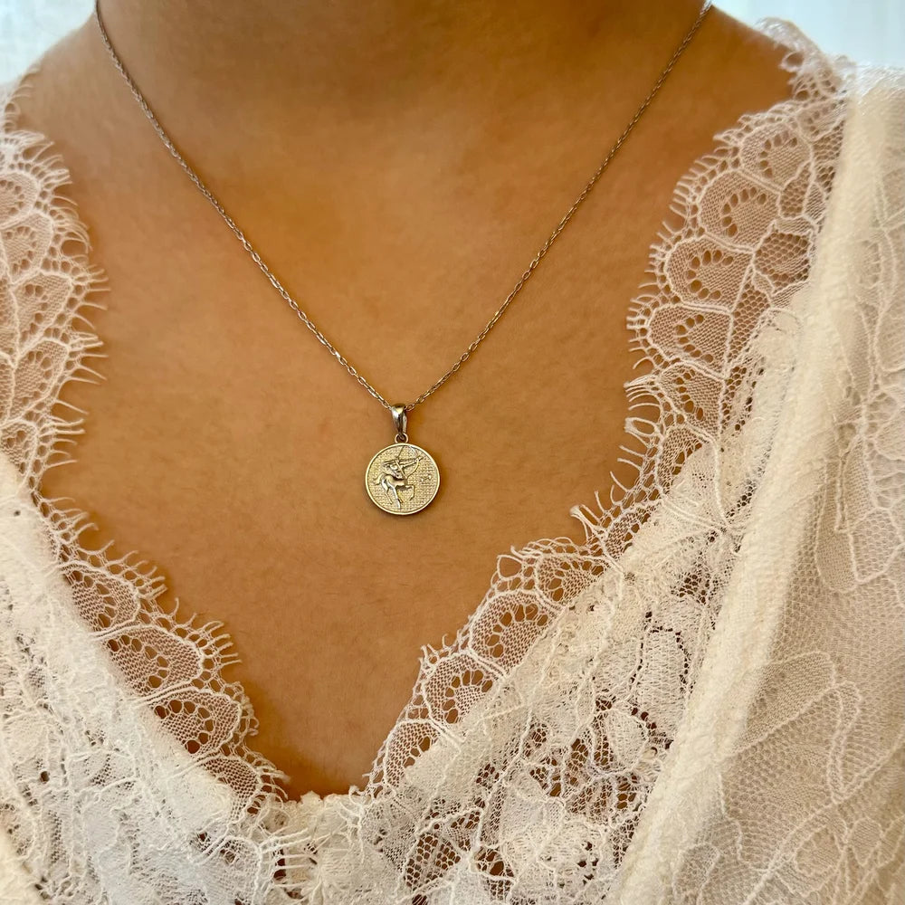 Sterling silver pendant necklace with intricate design, perfect for women seeking minimalist, elegant style.