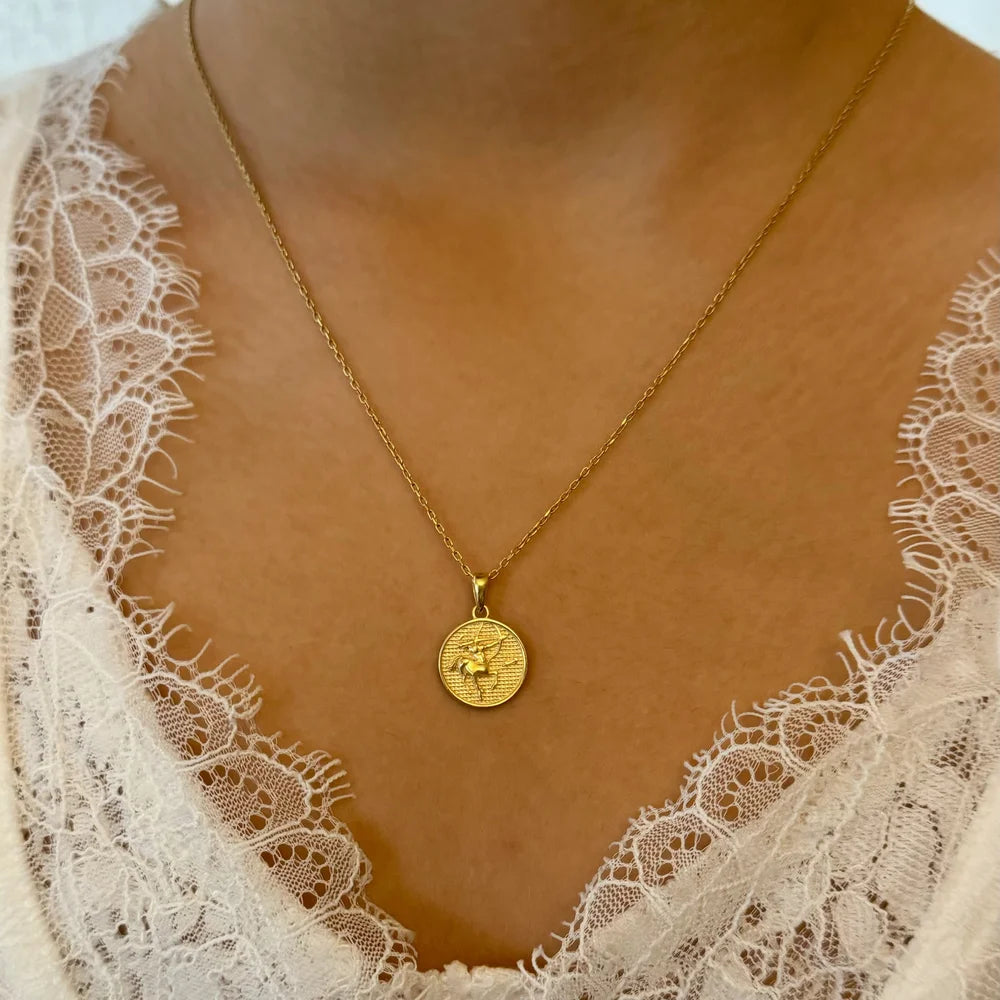 Gold coin pendant necklace on a delicate chain, ideal for women seeking a minimalist, elegant style for special occasions.