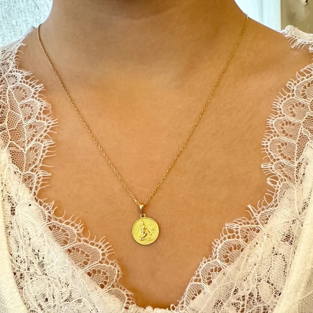 Gold pendant necklace with a vintage design, perfect for women seeking a classy, everyday accessory.
