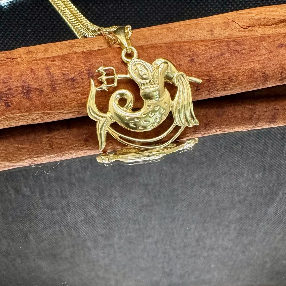 Gold mermaid pendant necklace, perfect for women who love whimsical, ocean-inspired jewelry. Great for casual or special occasions.