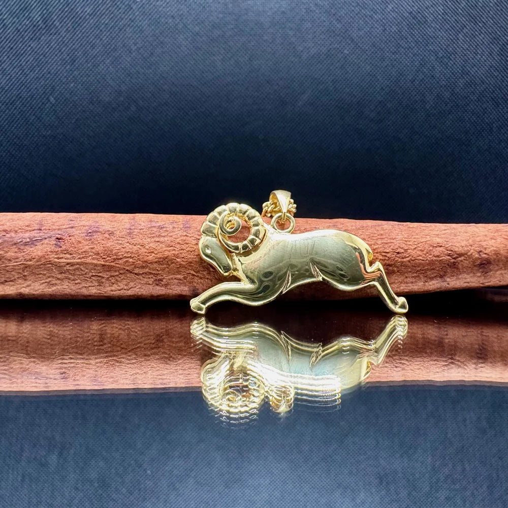Gold ram pendant featuring intricate details, perfect for zodiac lovers. Ideal for women seeking stylish, meaningful jewelry.