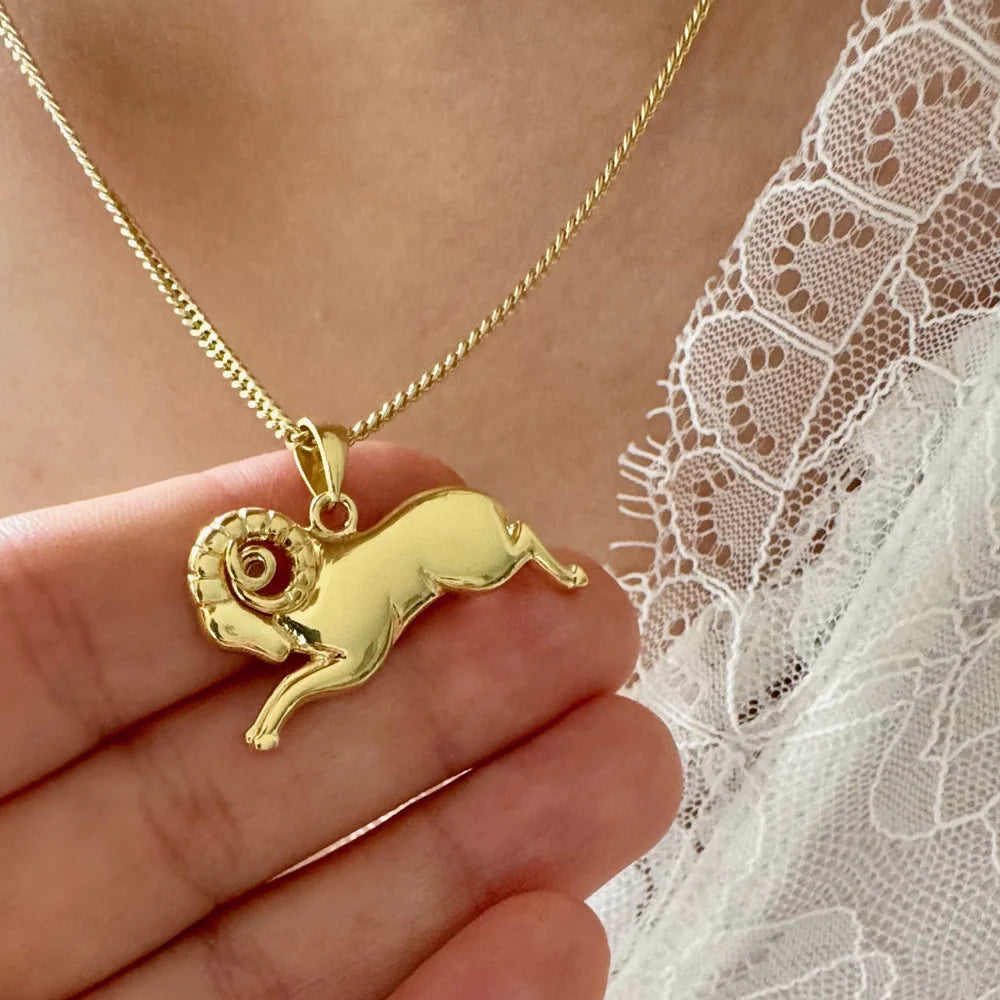 Gold ram pendant necklace, perfect for women seeking a unique, stylish accessory for casual or elegant occasions.